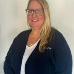 Alana smiling at the camera.